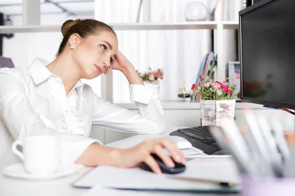 Tired woman manager in the office — Stock Photo, Image