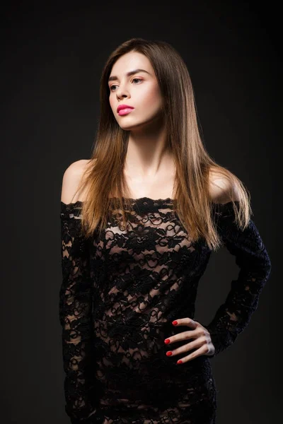 Beautiful woman in a black dress — Stock Photo, Image