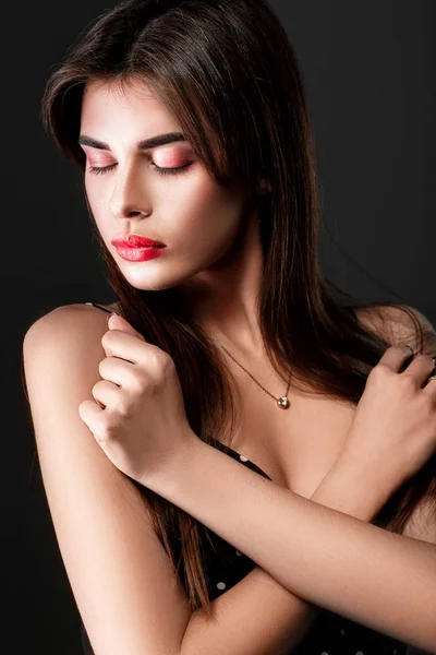 Beautiful woman in a black dress — Stock Photo, Image