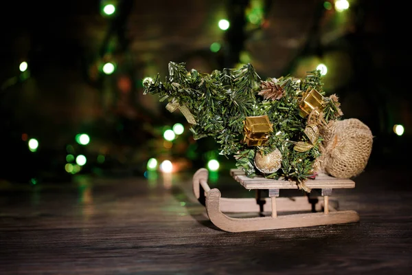 Fir-tree on sled on Christmas background — Stock Photo, Image