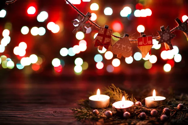 Candles and garland of New Years decor — Stock Photo, Image