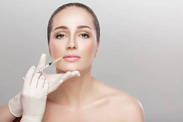 Beautiful woman getting injection — Stock Photo, Image