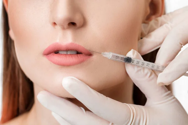 Woman getting injection on lips. — Stock Photo, Image