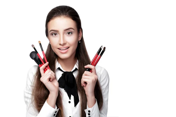 Make-up artist holding makeup brush — Stock Photo, Image