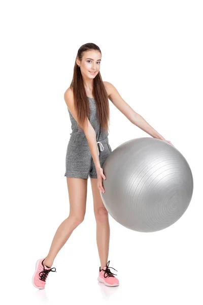 Woman in sports clothes with fitness ball — Stock Photo, Image
