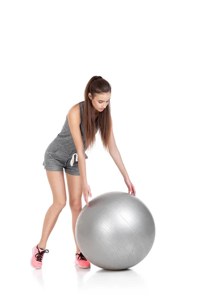 Mulher em roupas esportivas com bola de fitness Imagens Royalty-Free