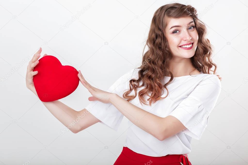 woman holding red heart