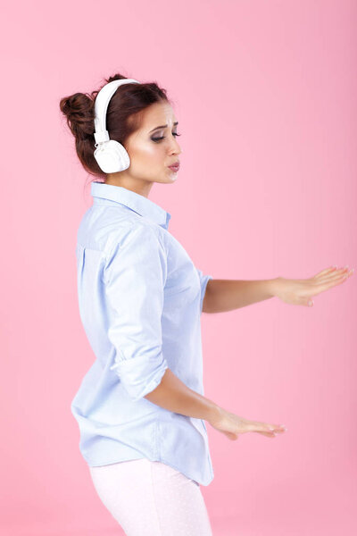 woman in headphones listening to music