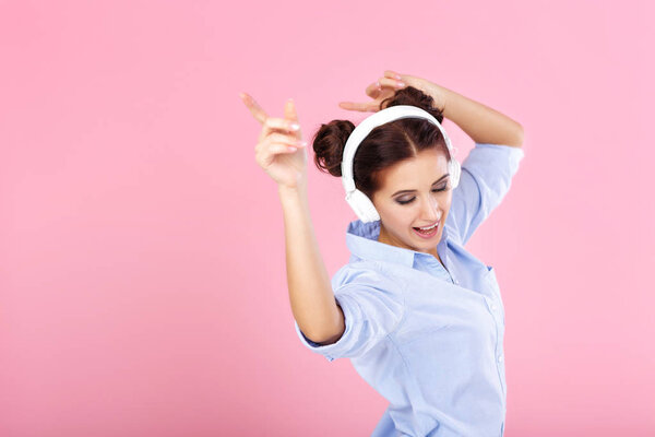 woman in headphones listening to music