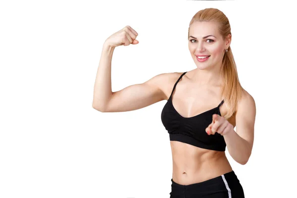 Menina em sportswear faz exercícios e olha para a câmera — Fotografia de Stock