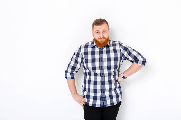 man with red hair and beard in plaid shirt