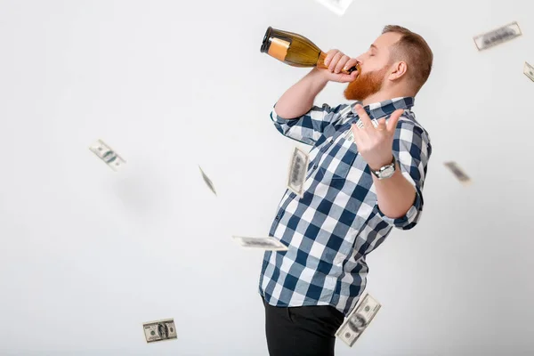 Man drinks champagne from bottle — Stock Photo, Image