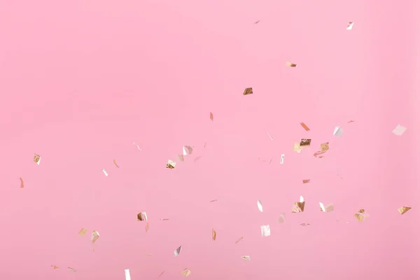 Χρυσά κομφετί σε ροζ φόντο — Φωτογραφία Αρχείου