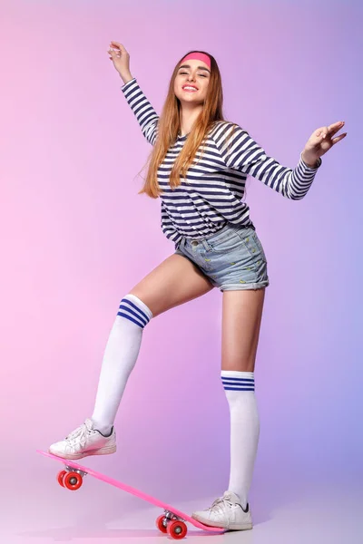 Beautiful woman with skate in studio — Stock Photo, Image