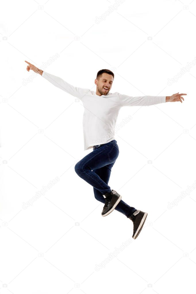 handsome young bearded man jumping