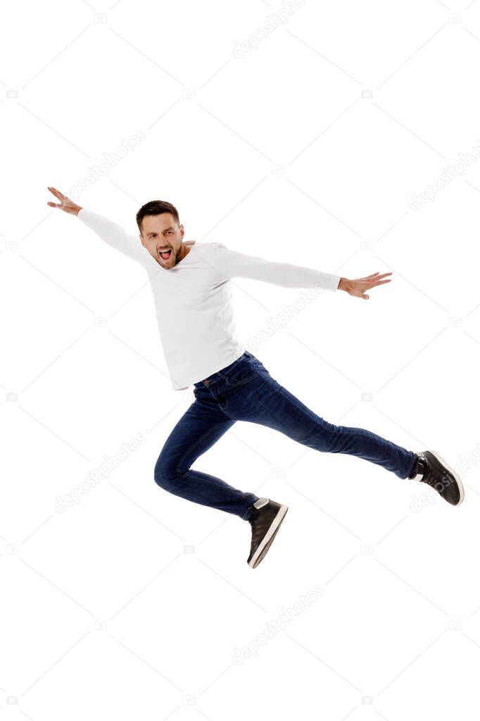 handsome young bearded man jumping