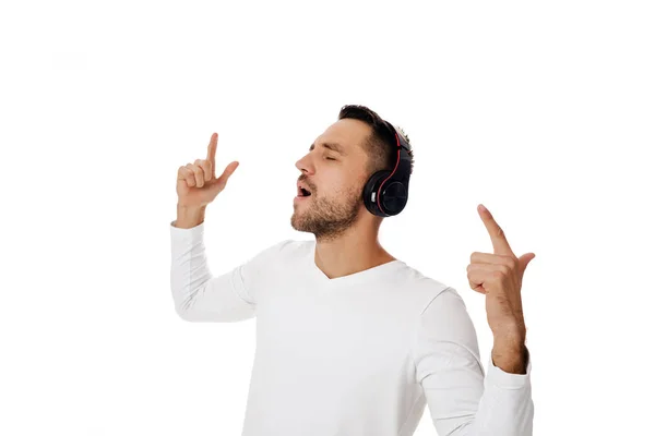 Young man in headphones listening to music — Stock Photo, Image