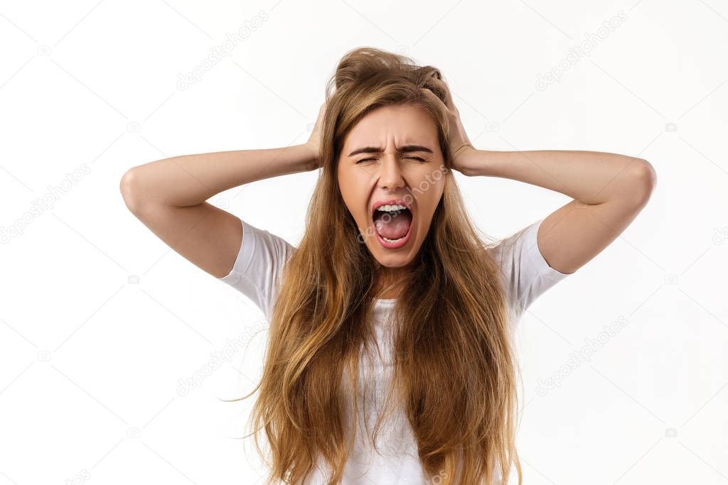 Portrait of young angry woman screaming