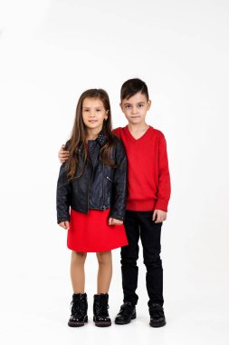 Happy smiling little kids in red outfit