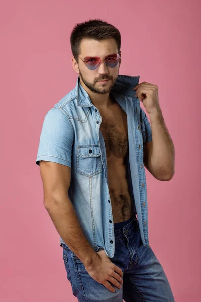 Handsome young man in heart shaped sunglasses — Stock Photo, Image