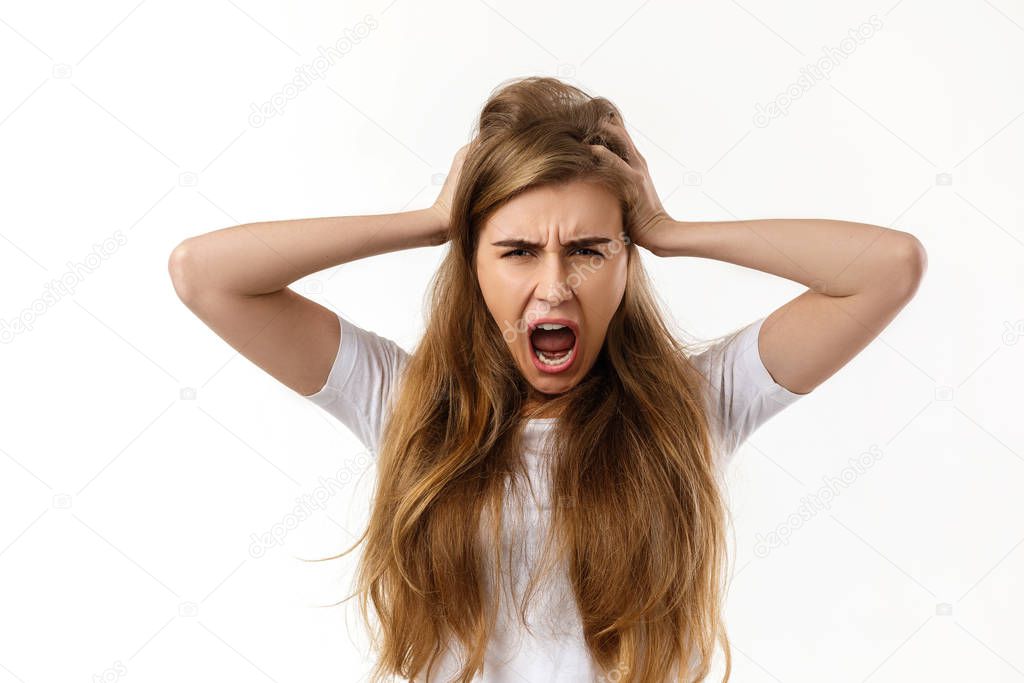 Portrait of young angry woman screaming