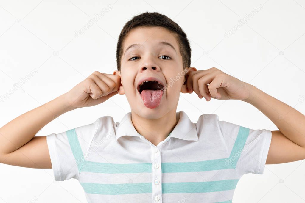 happy funny little child boy in striped t-shirt having fun