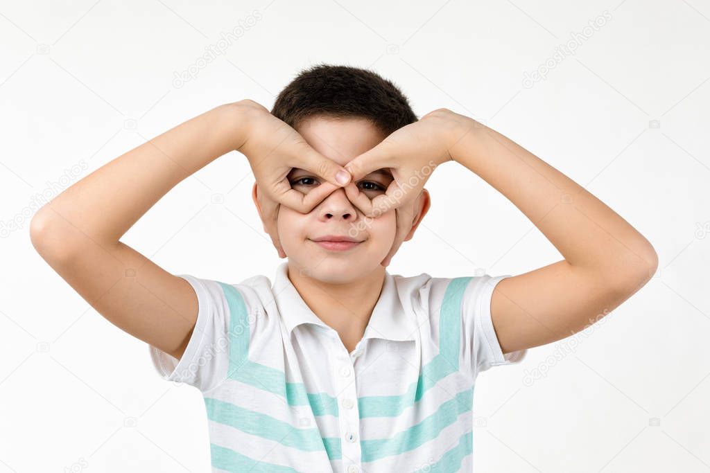 happy funny little child boy in striped t-shirt having fun