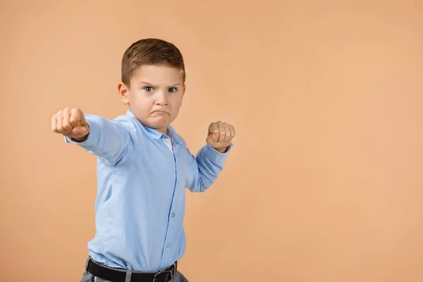 Angry little child boy mad raising fist — Stock Photo, Image