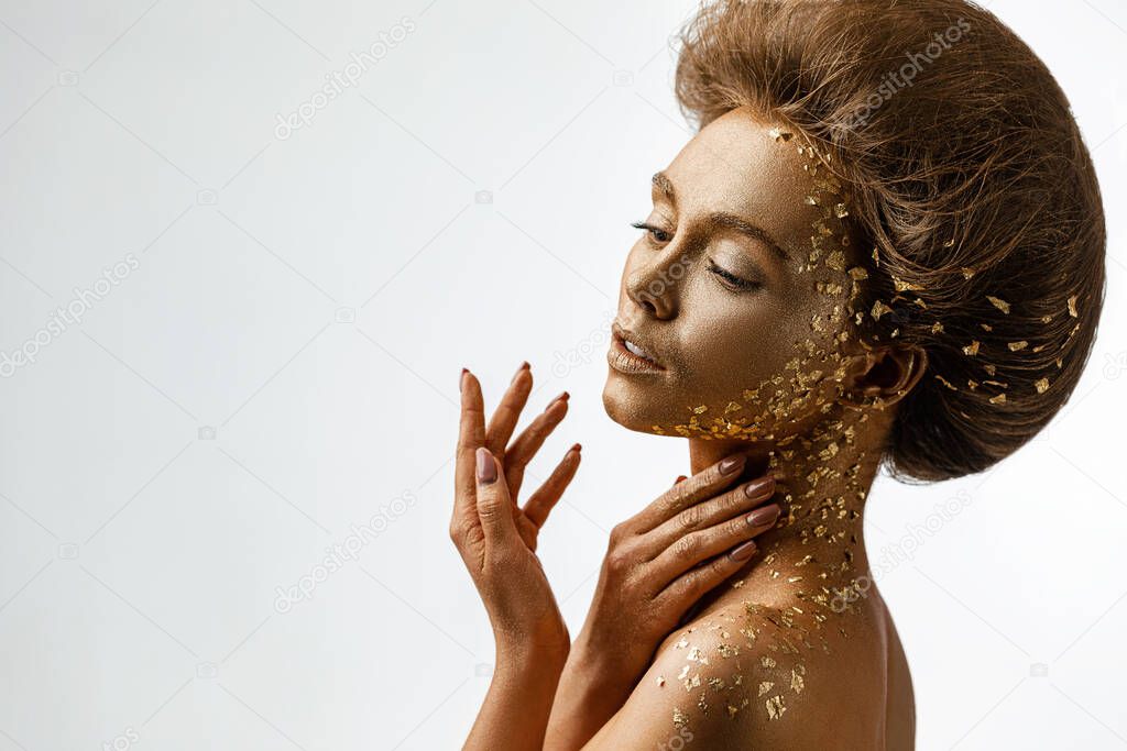 model girl with holiday golden shiny professional makeup.