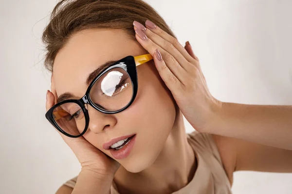 Portrait of woman model in dress wearing glasses — Stock Photo, Image