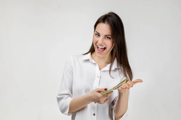 Smiling woman holding money — Stock Photo, Image