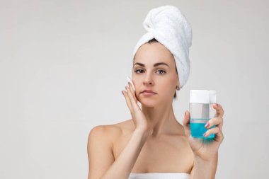 woman with a sponge cotton pad