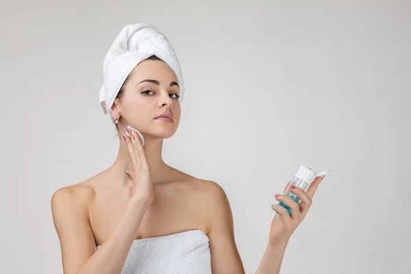 Woman with a sponge cotton pad — Stock Photo, Image