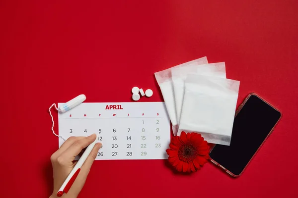 Menstrual pads and red flower — Stock Photo, Image
