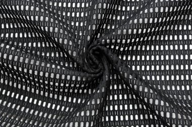 Orijinal siyah dantel kumaş bir delikte. Kumaşın büyük oranda kaldırılmış dokusu arka plan olarak kullanışlıdır.