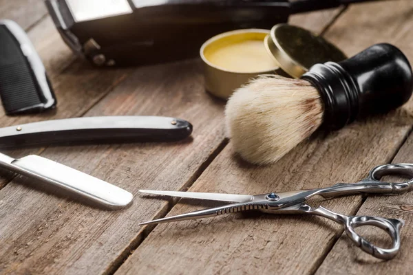 Barber scissors on wooden surface — Stock Photo, Image