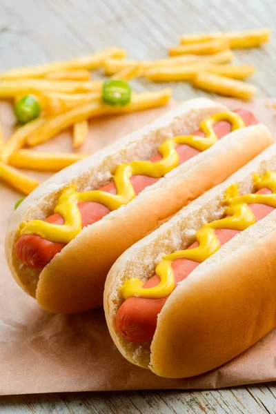 Appetizing hot dogs and potatoes — Stock Photo, Image