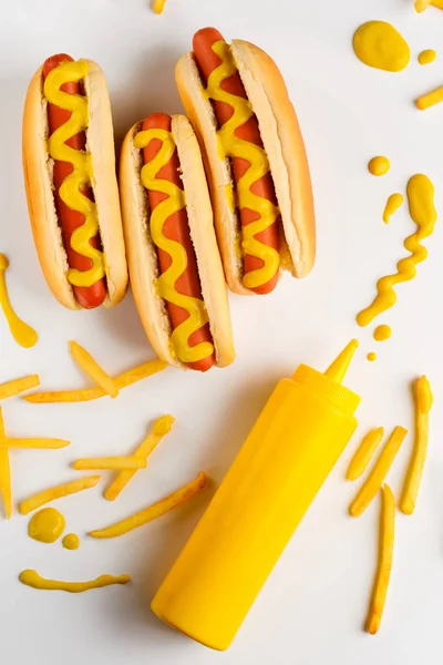 Hot dogs and mustard drops — Stock Photo, Image