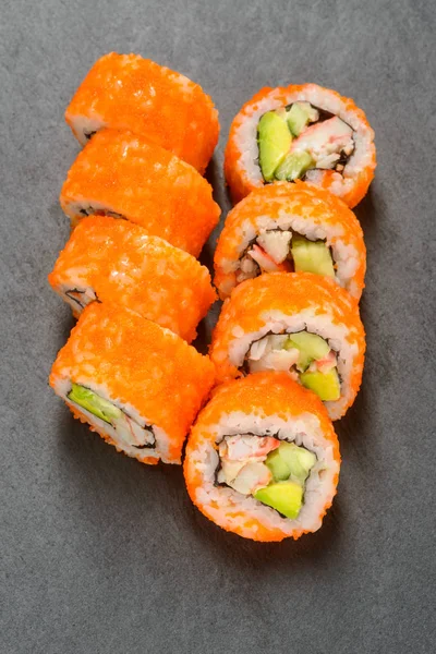 California rolls on grey surface