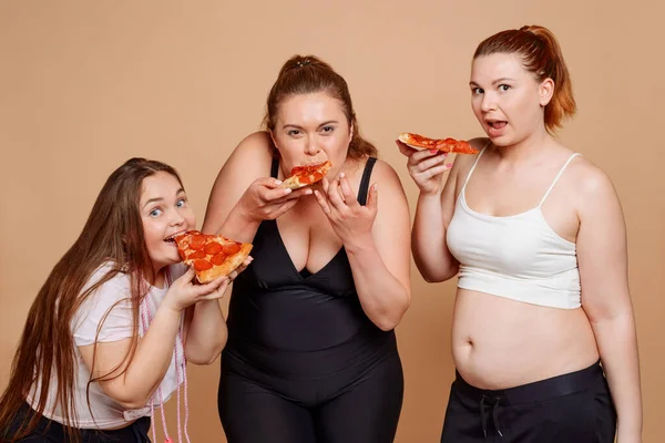 Fat girls caught eating pizza after fitness classes