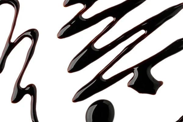 ジグザグ、滴とチョコレートで描かれた波状の線 — ストック写真