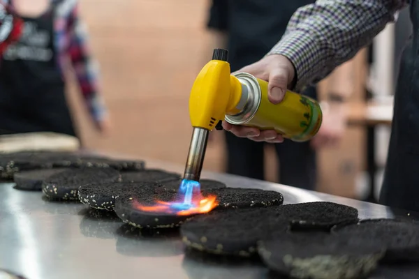 Cook using a kitchen torch to crisp up buns