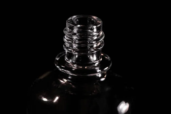 Close-up shot of a vial neck on black background — Stock Photo, Image