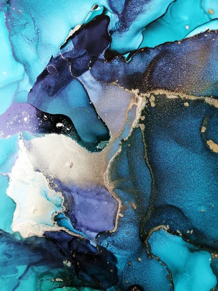 Luxury abstract fluid art painting in alcohol ink technique, mixture of blue and green paints. Imitation of marble stone cut, glowing golden veins. Tender and dreamy design.