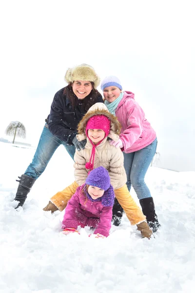 Happy family enjoying in winter Stock Photo