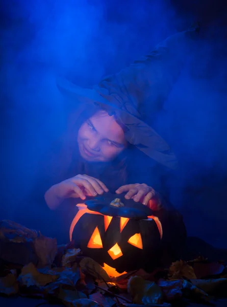 The little witch with halloween pumpkin — Stock Photo, Image