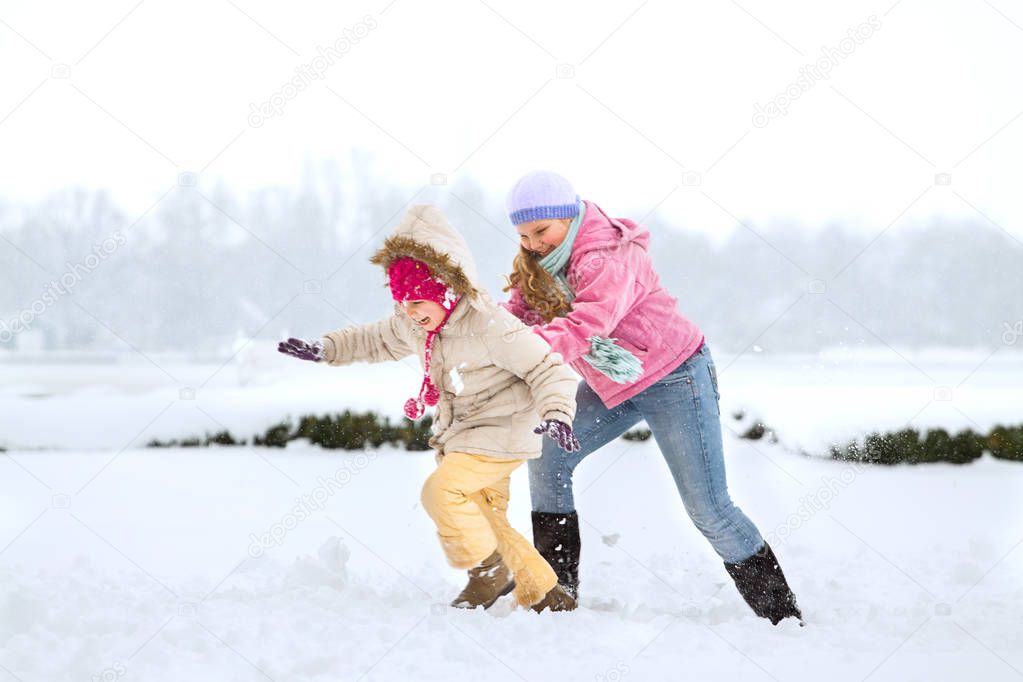 Happy family enjoying in winter