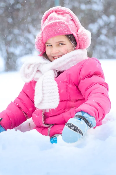 Little child playing in snow Royalty Free Stock Photos