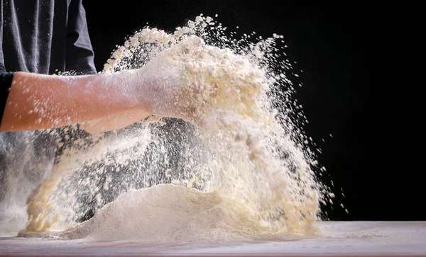 Making dough by female hands at home in kitchen — Stock Photo, Image