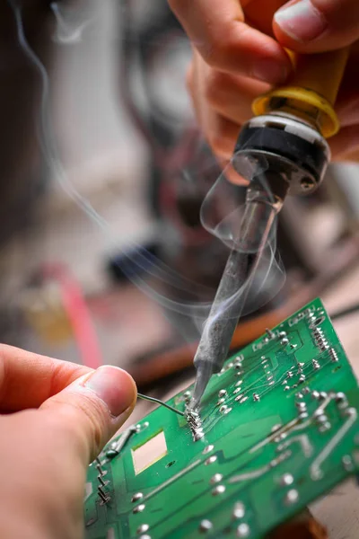 Repair of electronic devices, tin soldering parts — Stock Photo, Image